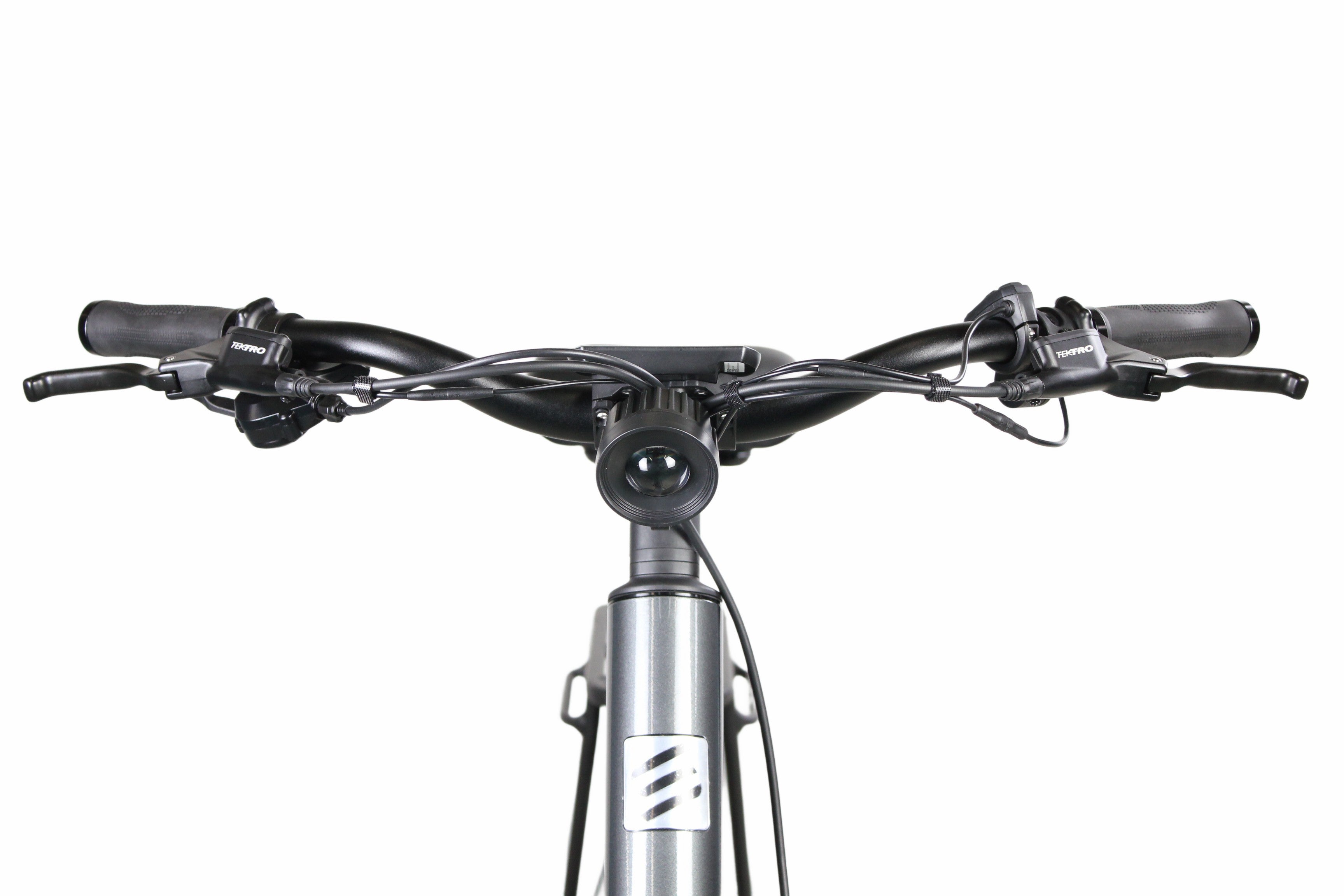 Front view of the Grey Synergy City 2 electric bike showcasing the handlebar setup, integrated front headlight, brake levers, and gear shifters