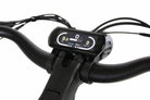 Close-up of the Synergy City 2 electric bike's LCD display mounted on the handlebars, showing speed, trip average, and power output.