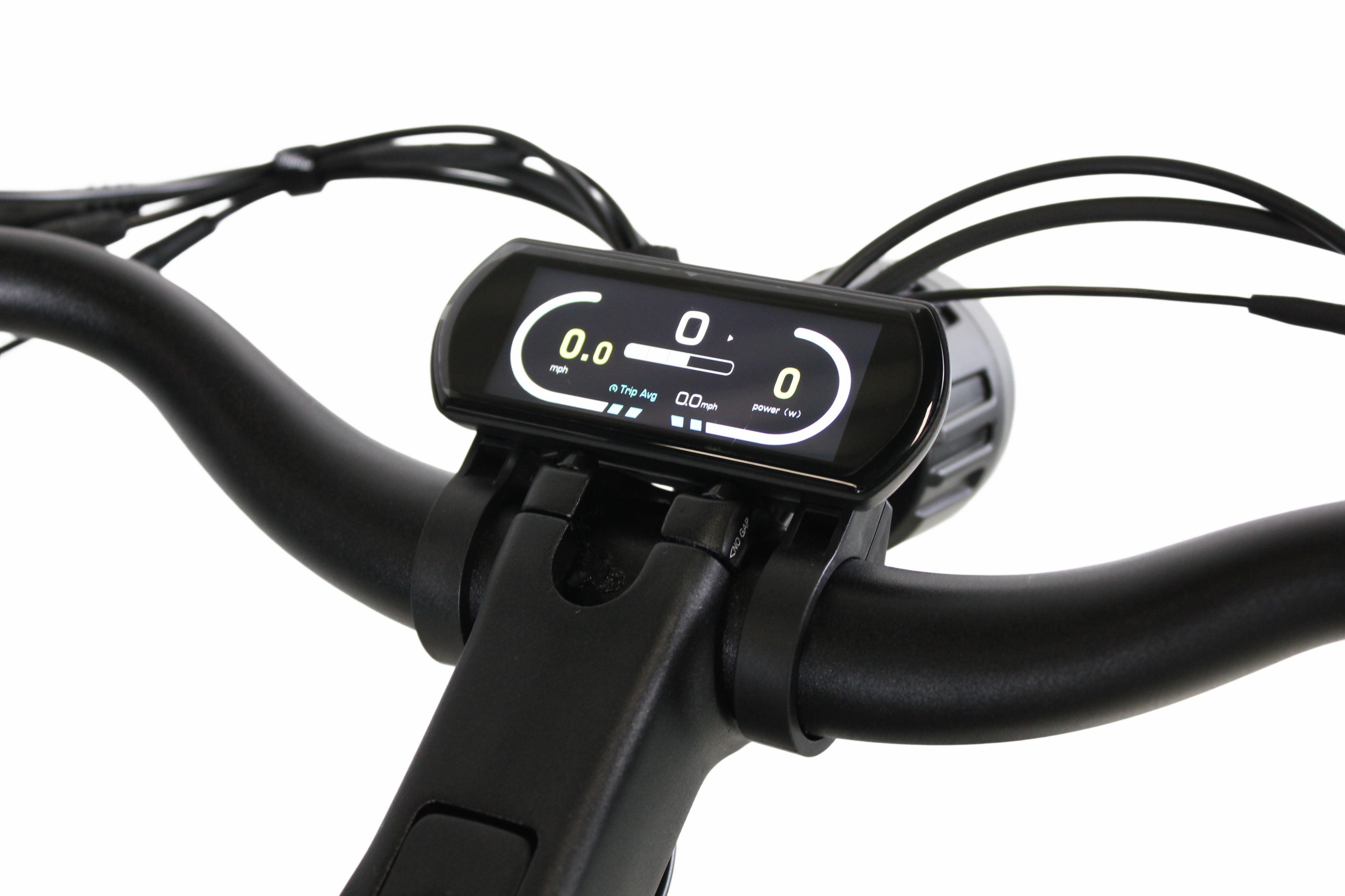 Close-up of the Synergy City 2 electric bike's LCD display mounted on the handlebars, showing speed, trip average, and power output.