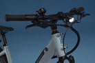 Close-up of RadKick Arctic Blue electric bike handlebar and front LED headlight
