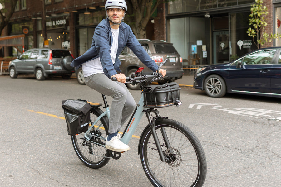 Person riding RadKick Arctic Blue electric bike in urban setting