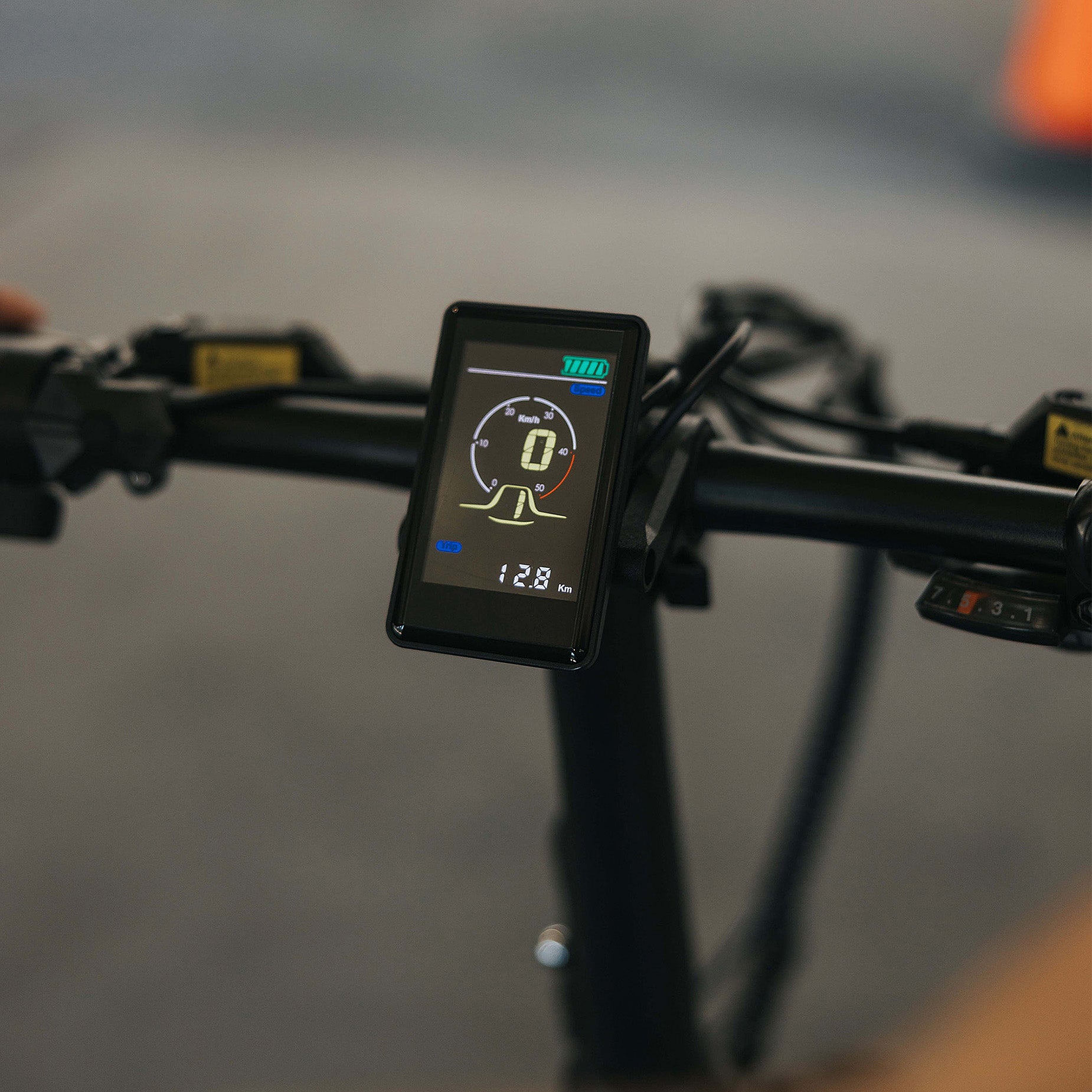 Close-up of Synergy Icon low-step e-bike LCD display showing speed and trip data