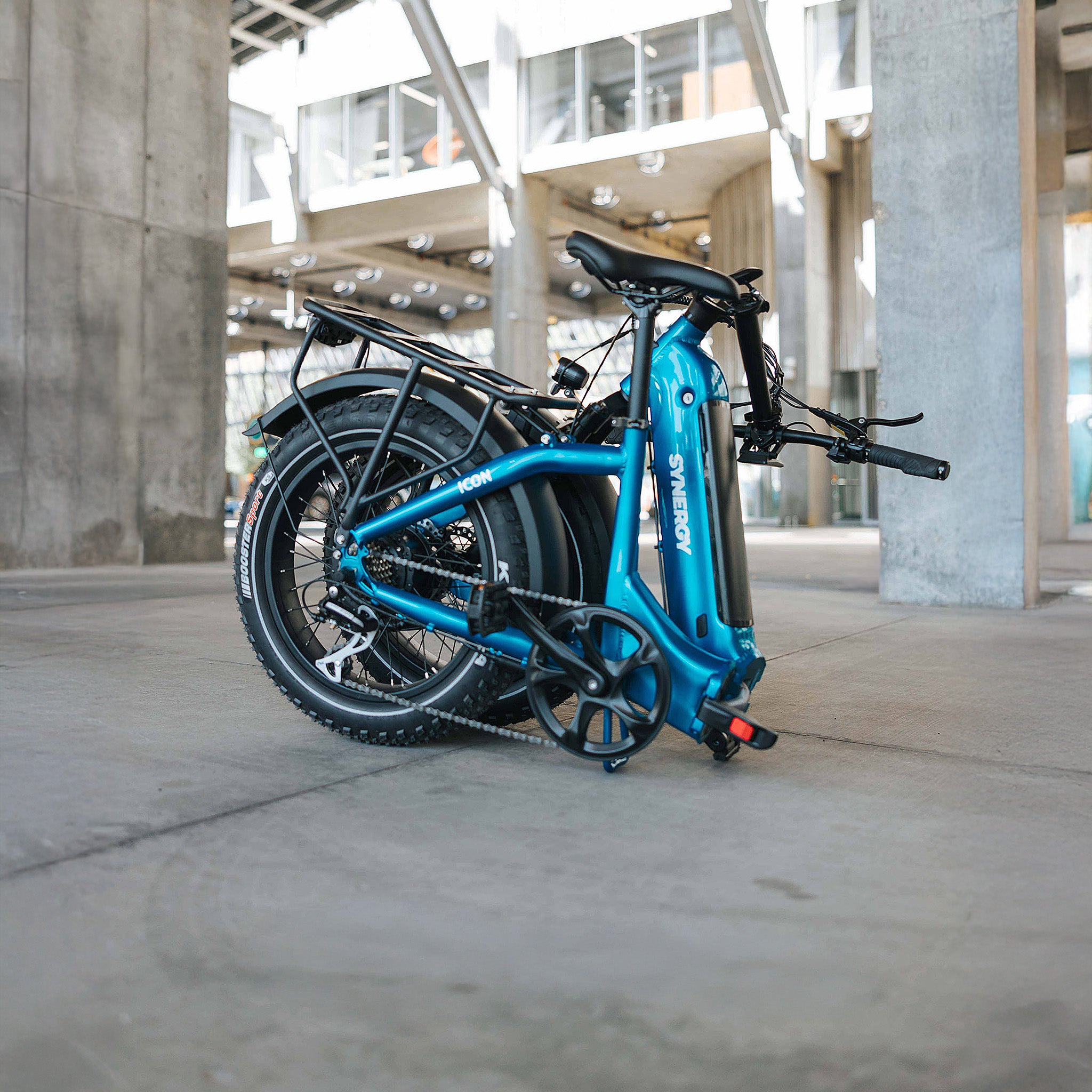 Blue Synergy ICON low step electric bike folded for compact storage